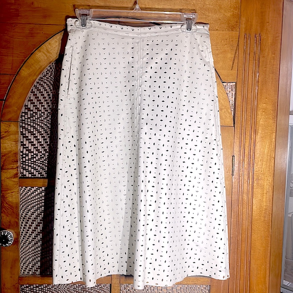 Winter-white pleather A-line skirt.